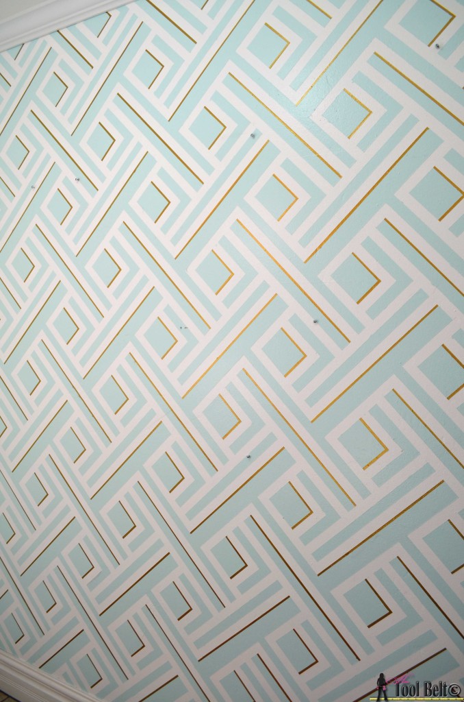 Painting a geometric wall tutorial on hertoolbelt.com Made with painters tape!