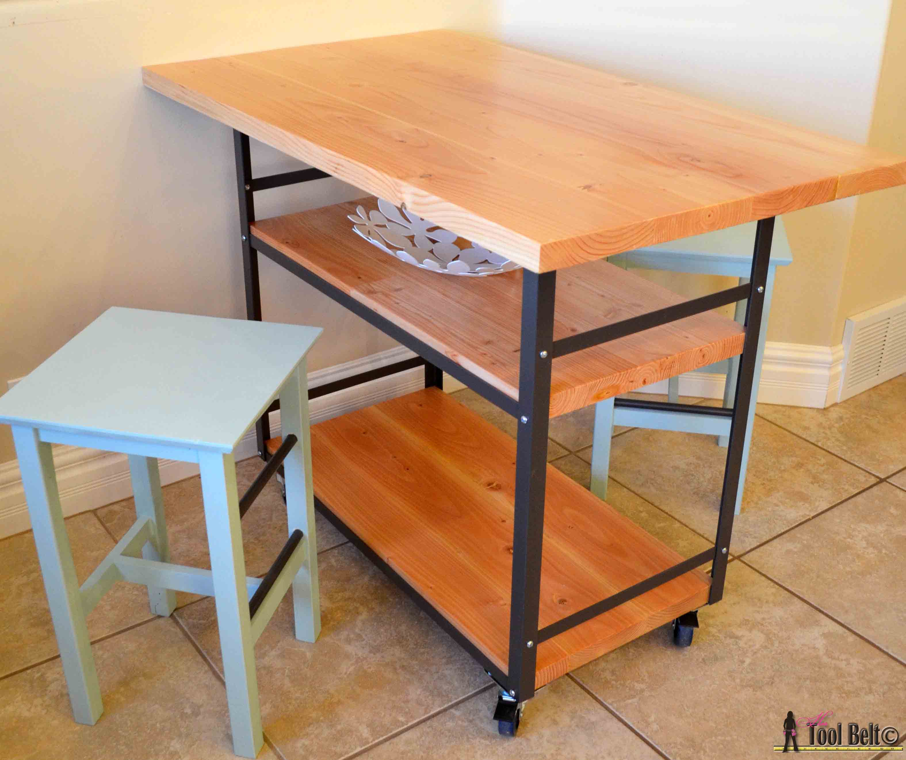Build a stylish DIY multi-functional table. Free plans for a rolling industrial counter table, rolling island with lots of open storage.