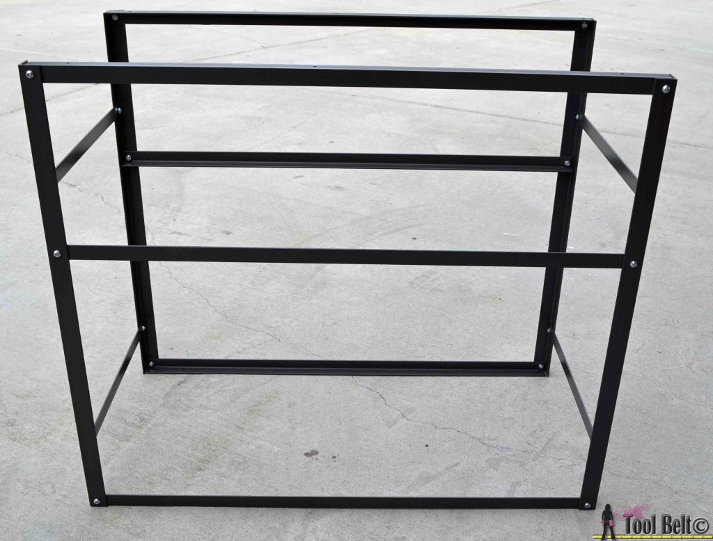 Build a stylish DIY multi-functional table. Free plans for a rolling industrial counter table, rolling island with lots of open storage.