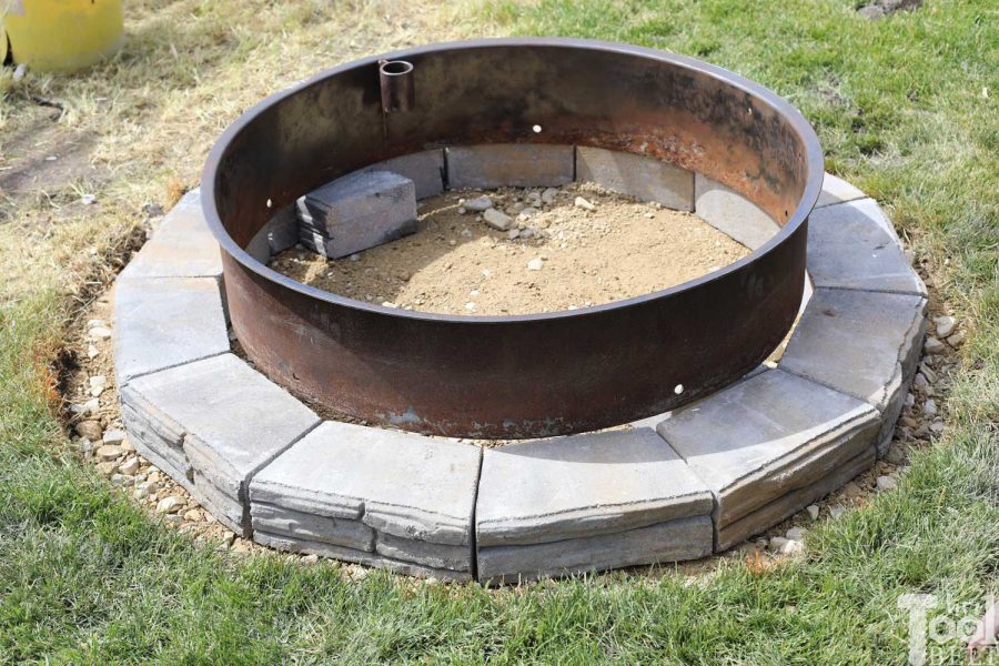 1st layer - How to build a DIY backyard firepit with wall blocks from Home Depot.